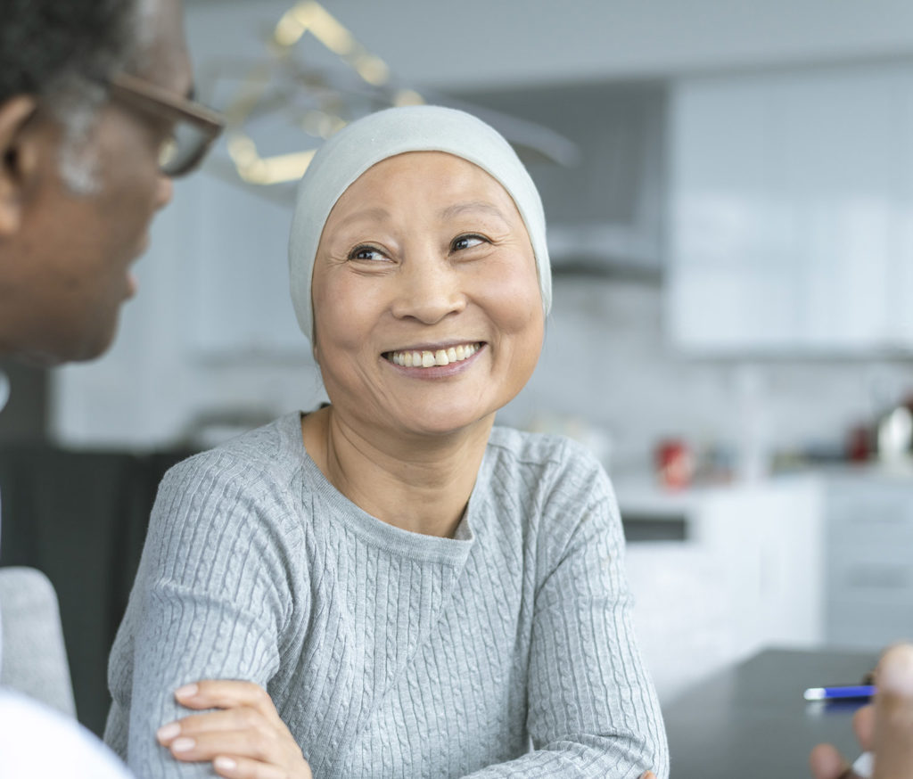 Patient smiles during consult with caregiver